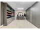 Spacious walk-in closet with custom shelves, drawers, and ample storage for handbags, accessories and clothing at 12854 Boggy Creek Dr, Riverview, FL 33579