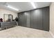 Large walk-in closet featuring custom closet systems with ample shelf and hanging space for clothing and accessories at 12854 Boggy Creek Dr, Riverview, FL 33579