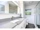 Updated bathroom featuring tile surround, modern vanity with a gray countertop and glass shower at 300 Venetian Dr # 7, Clearwater, FL 33755