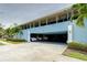 Exterior shot of a multi-Gathering property highlighting the covered carport at 300 Venetian Dr # 7, Clearwater, FL 33755