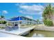 Charming waterfront condos featuring a dock with seating area and covered outdoor dining at 300 Venetian Dr # 7, Clearwater, FL 33755