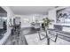 Living room area showcasing stylish decor, modern furnishings, and an adjacent workspace at 300 Venetian Dr # 7, Clearwater, FL 33755