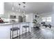 Modern kitchen open to a living room with stylish furniture and decor at 300 Venetian Dr # 7, Clearwater, FL 33755