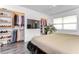 Primary bedroom with large closets, TV, and neutral decor, offering ample storage space at 300 Venetian Dr # 7, Clearwater, FL 33755