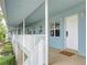 Exterior walkway leading to unit #1 with white railing and adjacent garden at 300 Venetian Dr # 7, Clearwater, FL 33755