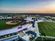 Aerial view of stadium featuring a baseball field, exterior, and parking lot at 19891 Bridgetown Loop, Venice, FL 34293