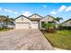 Charming single-Gathering home featuring a paved driveway and two-car garage at 19891 Bridgetown Loop, Venice, FL 34293