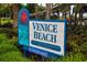 Venice Beach sign surrounded by lush greenery at 19891 Bridgetown Loop, Venice, FL 34293