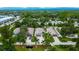 Aerial view of multiple homes with well-maintained lawns, mature trees, and a serene neighborhood setting at 3369 Houle Ave, Sarasota, FL 34232