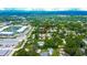 Aerial view of a residential area surrounded by lush greenery, pinpointing the listed home at 3369 Houle Ave, Sarasota, FL 34232