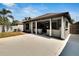 Backyard featuring an expansive patio and backyard with white privacy fence at 3369 Houle Ave, Sarasota, FL 34232