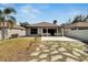 Backyard showcasing landscaping, privacy fence and patio at 3369 Houle Ave, Sarasota, FL 34232