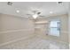 A bright, airy bedroom with wood-look floors, a modern ceiling fan, and a window with natural light enhancing the serene ambiance at 3369 Houle Ave, Sarasota, FL 34232