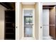 Bright bedroom featuring wood floors, a ceiling fan, and views of the outdoor landscaping at 3369 Houle Ave, Sarasota, FL 34232