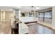Cozy dining nook with built-in seating, hardwood floors, and abundant natural light at 3369 Houle Ave, Sarasota, FL 34232
