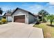 Well-maintained single-story home with a tidy front yard, spacious driveway, and a convenient two-car garage at 3369 Houle Ave, Sarasota, FL 34232