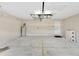The spacious garage offers ample storage and parking space, including a water heater and additional cabinet space at 3369 Houle Ave, Sarasota, FL 34232