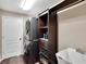 Laundry room features a washer and dryer, storage cabinets, and a sink, providing a functional and organized space at 3369 Houle Ave, Sarasota, FL 34232