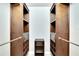 A walk-in closet with custom shelving and ample storage space at 3369 Houle Ave, Sarasota, FL 34232