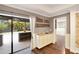 Wet Bar next to the screened in porch with a built-in counter and white cabinets for entertaining at 3369 Houle Ave, Sarasota, FL 34232