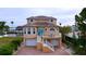 Stunning waterfront home featuring unique architectural details and a colorful teal entry door at 4178 Des Prez Ct, Hernando Beach, FL 34607