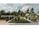 Vibrant community park with lush green space, garden beds, shaded seating areas, and plenty of room for outdoor recreation at 9650 Minnow Ray Dr, Land O Lakes, FL 34638