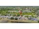 Aerial view of the community, showcasing a neighborhood with mature trees, ponds, and a playground at 11321 Flora Springs Dr, Riverview, FL 33579