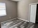 Bedroom with wood-look floors, a ceiling fan, and a closet at 11321 Flora Springs Dr, Riverview, FL 33579
