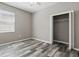 Bedroom boasts natural light, a ceiling fan, and a closet for ample storage at 11321 Flora Springs Dr, Riverview, FL 33579