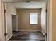 An inviting bedroom has neutral walls, new vinyl floors, a window, and closet with plenty of room at 11321 Flora Springs Dr, Riverview, FL 33579
