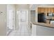 Kitchen with long hallway with lots of storage and pantry shelving space at 11321 Flora Springs Dr, Riverview, FL 33579