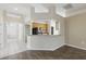 Living area showcases a breakfast bar, modern light fixtures, and seamlessly connects to the kitchen at 11321 Flora Springs Dr, Riverview, FL 33579