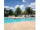 Community pool featuring lots of chairs for relaxing in the sun during the summer at 11321 Flora Springs Dr, Riverview, FL 33579