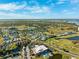 Wide aerial view of a community with lakes, a golf course, and various home styles under a sunny sky at 2825 Terra Ceia Bay Blvd # 1902, Palmetto, FL 34221