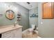 Bathroom featuring granite countertops, a decorative mirror, and tile flooring at 2825 Terra Ceia Bay Blvd # 1902, Palmetto, FL 34221
