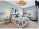 Bright bedroom featuring a patterned bedspread, ceiling fan, and stylish decor at 2825 Terra Ceia Bay Blvd # 1902, Palmetto, FL 34221