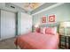 Cozy bedroom features a queen bed, ceiling fan, and decorative artwork at 2825 Terra Ceia Bay Blvd # 1902, Palmetto, FL 34221