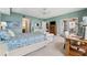 A bedroom with a ceiling fan and a sitting area with a balcony at 2825 Terra Ceia Bay Blvd # 1902, Palmetto, FL 34221