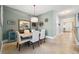 Dining room featuring a neutral color scheme, tile flooring, pendant light and lots of decor at 2825 Terra Ceia Bay Blvd # 1902, Palmetto, FL 34221