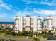 Stunning exterior view of luxury apartment complex, highlighting its architectural design and landscaping at 2825 Terra Ceia Bay Blvd # 1902, Palmetto, FL 34221