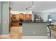 Open floor plan with a kitchen featuring a raised countertop bar, wooden cabinets and stainless steel appliances at 2825 Terra Ceia Bay Blvd # 1902, Palmetto, FL 34221