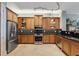 A kitchen featuring stainless steel appliances, granite countertops and maple cabinetry with glass door accents at 2825 Terra Ceia Bay Blvd # 1902, Palmetto, FL 34221