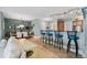Open living area featuring a kitchen, bar seating, and dining room with neutral colors and tile floors at 2825 Terra Ceia Bay Blvd # 1902, Palmetto, FL 34221