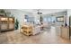Bright and airy living room with tile floors, a ceiling fan, and access to a balcony with water views at 2825 Terra Ceia Bay Blvd # 1902, Palmetto, FL 34221