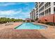 Outdoor swimming pool and spa with lounge chairs, a gazebo, and lush landscaping at 2825 Terra Ceia Bay Blvd # 1902, Palmetto, FL 34221