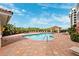Outdoor swimming pool with lounge chairs, a gazebo, and lush landscaping at 2825 Terra Ceia Bay Blvd # 1902, Palmetto, FL 34221