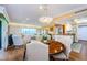 Bright, open dining area showcasing a stylish table with seating and views to the living space at 36750 Us Highway 19 # 21-301, Palm Harbor, FL 34684