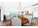 Bright, open dining area showcasing a stylish table with seating and views to the living space at 36750 Us Highway 19 # 21-301, Palm Harbor, FL 34684
