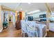 Open concept kitchen featuring a breakfast bar, white cabinets, and modern appliances at 36750 Us Highway 19 # 21-301, Palm Harbor, FL 34684