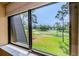 Scenic view of the golf course from the window, highlighting the beautiful outdoor surroundings at 36750 Us Highway 19 # 21-301, Palm Harbor, FL 34684